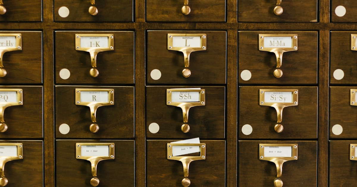 A brown wooden card catalog