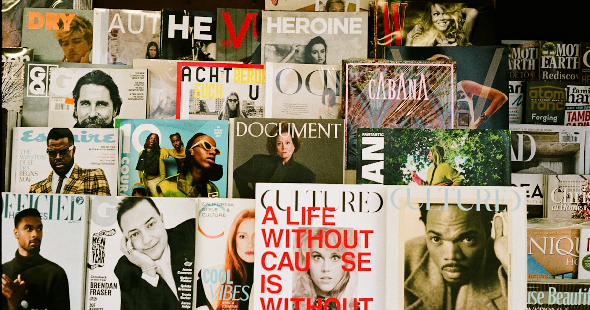 Magazines stacked on a wall