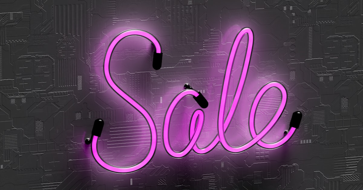 A neon sign that says sale